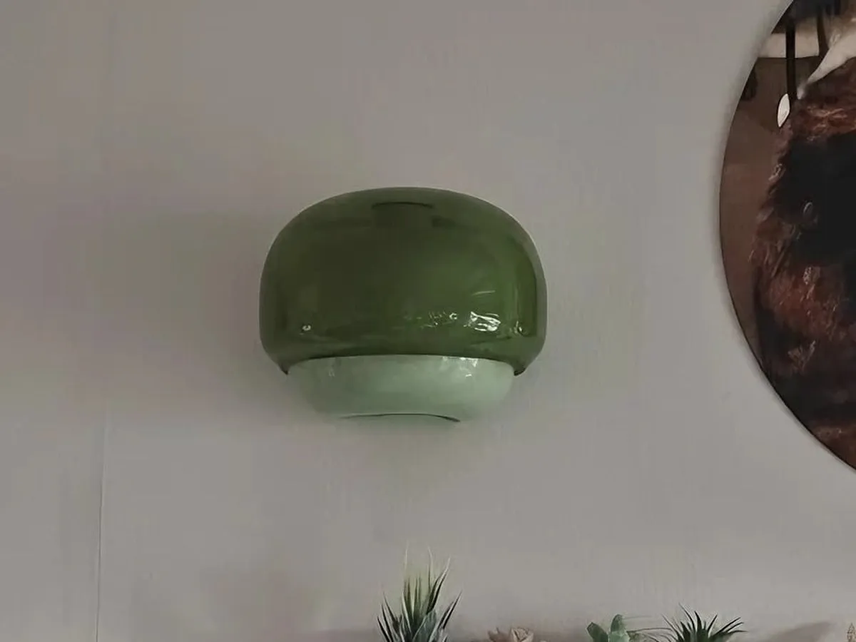 Green Clinco lamp fully visible beside a framed print, photographed by Mr