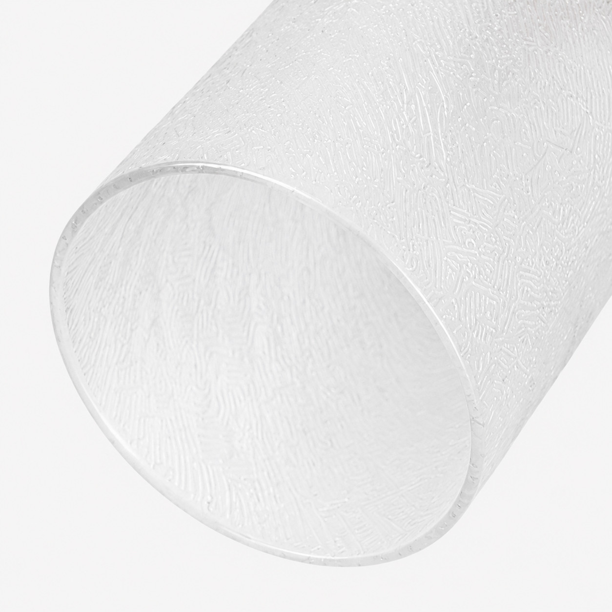 Gros plan d'un abat-jour cylindrique en verre blanc dépoli texturé