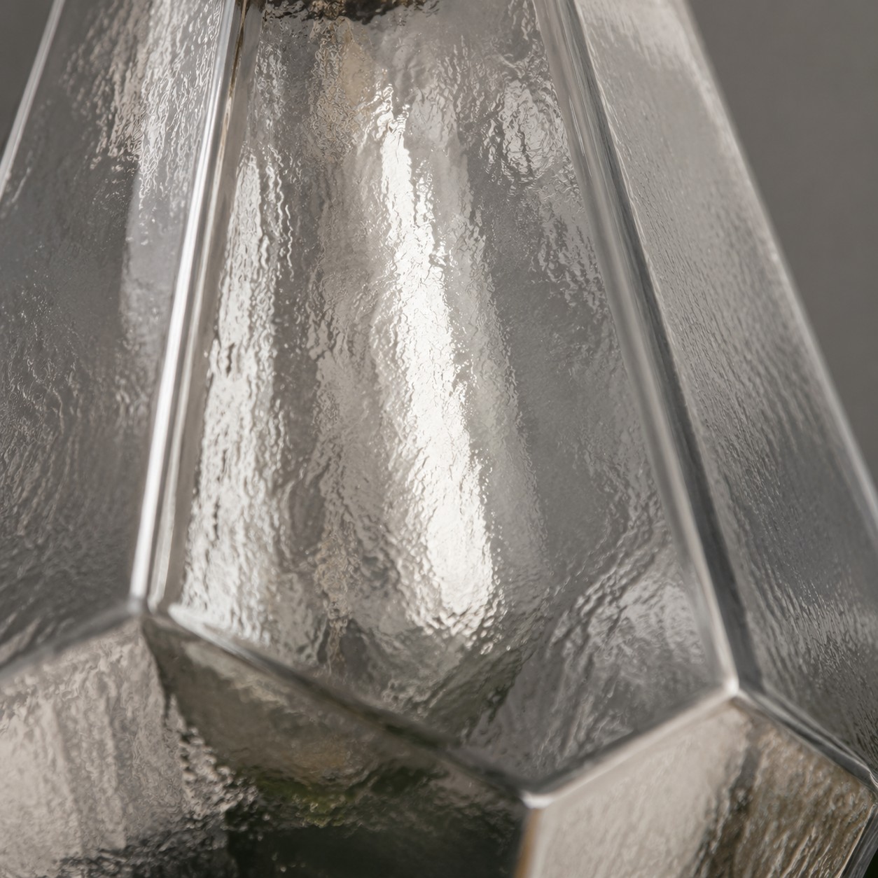 Close view of the textured clear glass pendant shade