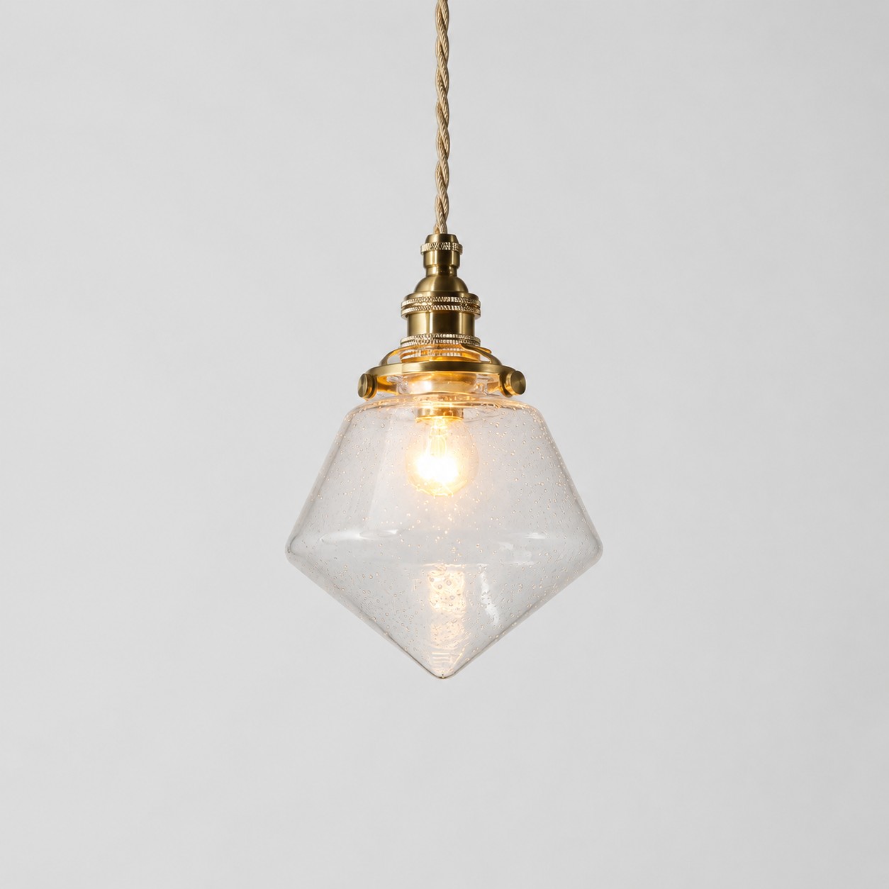 Hand-blown bubble glass pendant with brass-toned hardware