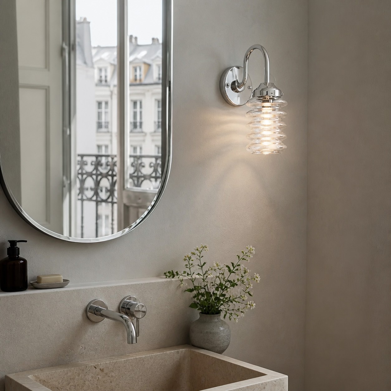 White ribbed glass sconce beside a bed