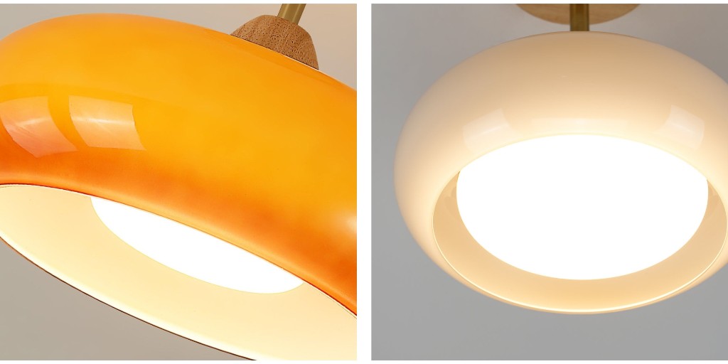 Close-up van de oranje glazen Bauhaus-plafondlamp die gloeit
