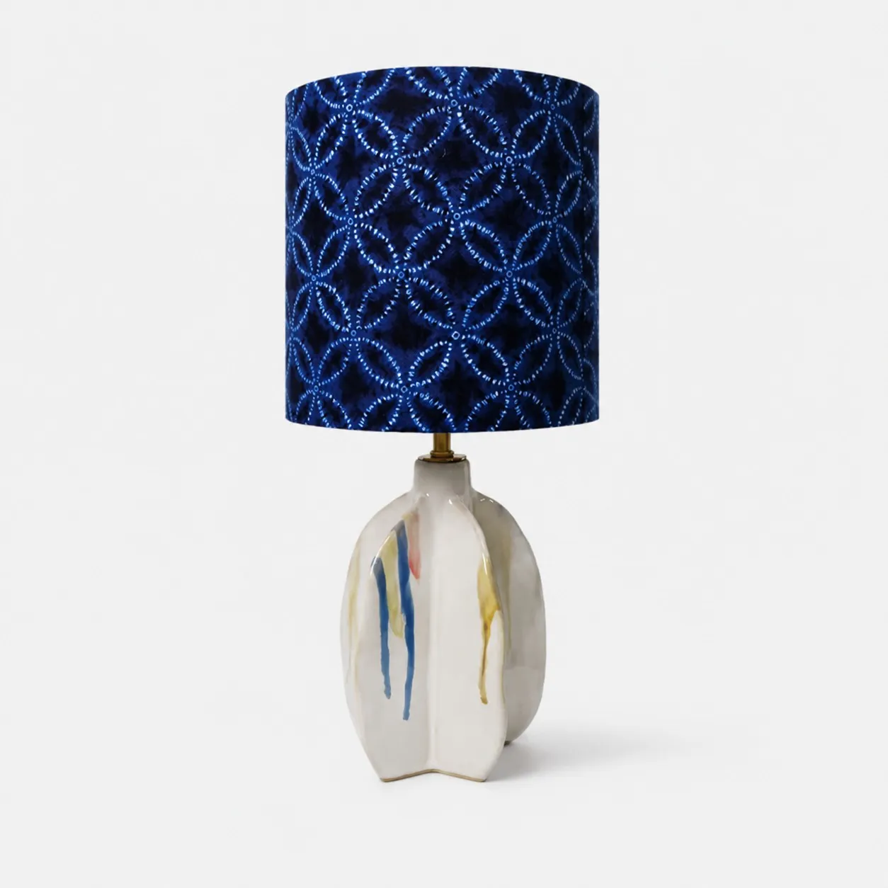 Handmade ceramic table lamp with blue patterned fabric shade