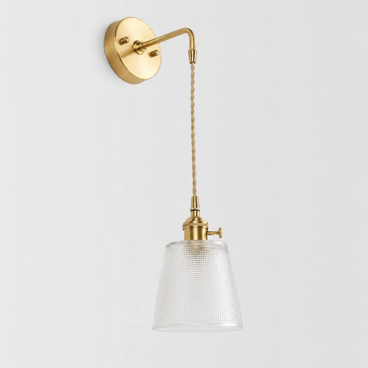 Semi clear glass wall light with brass arm, BW shade 12 cm high and 13 cm diameter