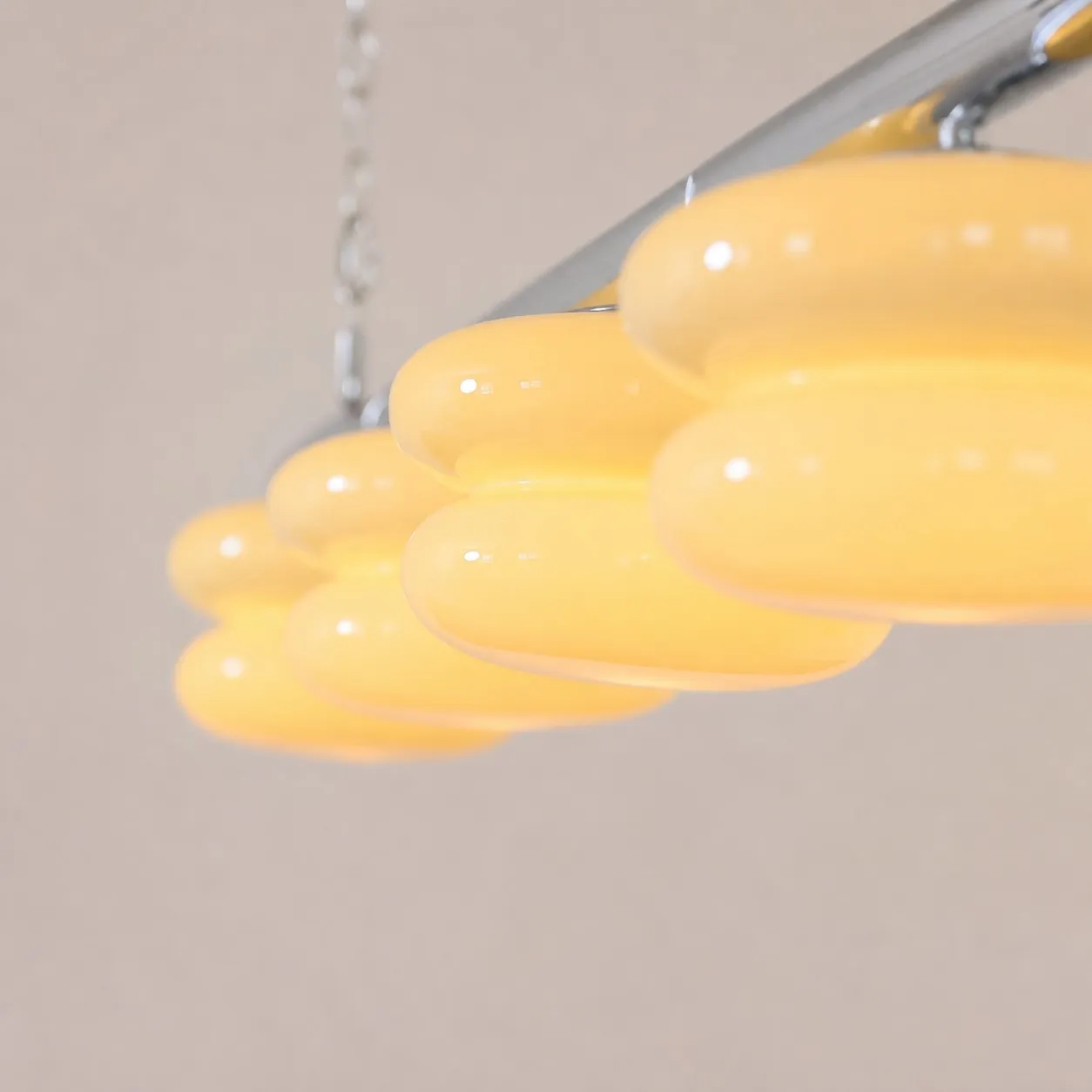 Polished metal rail and hanging chain detail