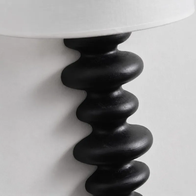 Ebony carved wood wall lamp detail
