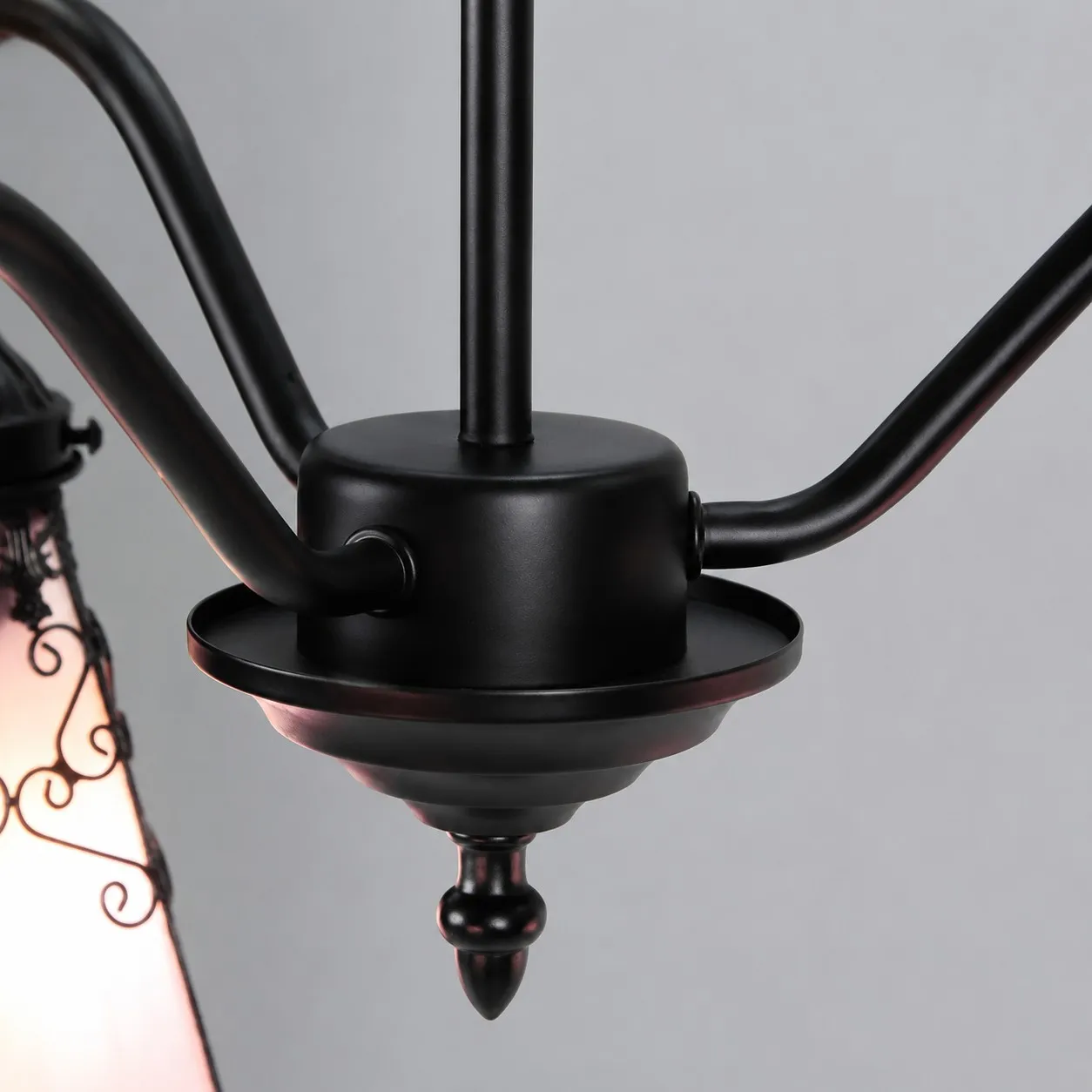 Black iron arm and center hardware detail