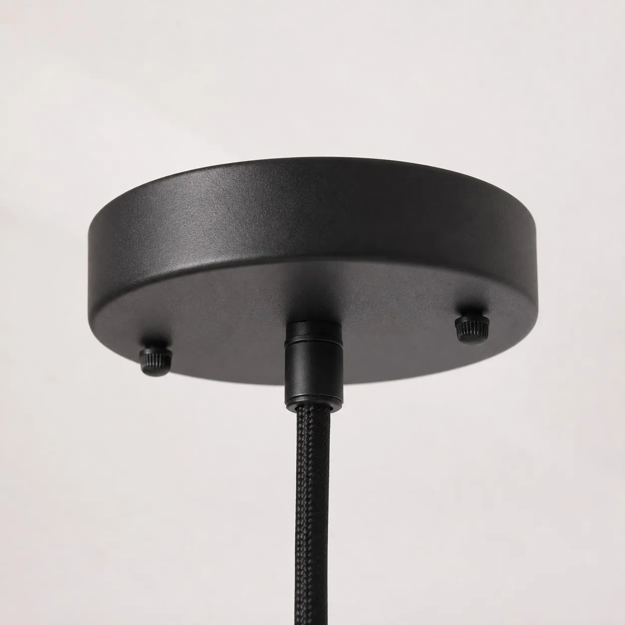 Black ceiling canopy detail for wooden pendant light