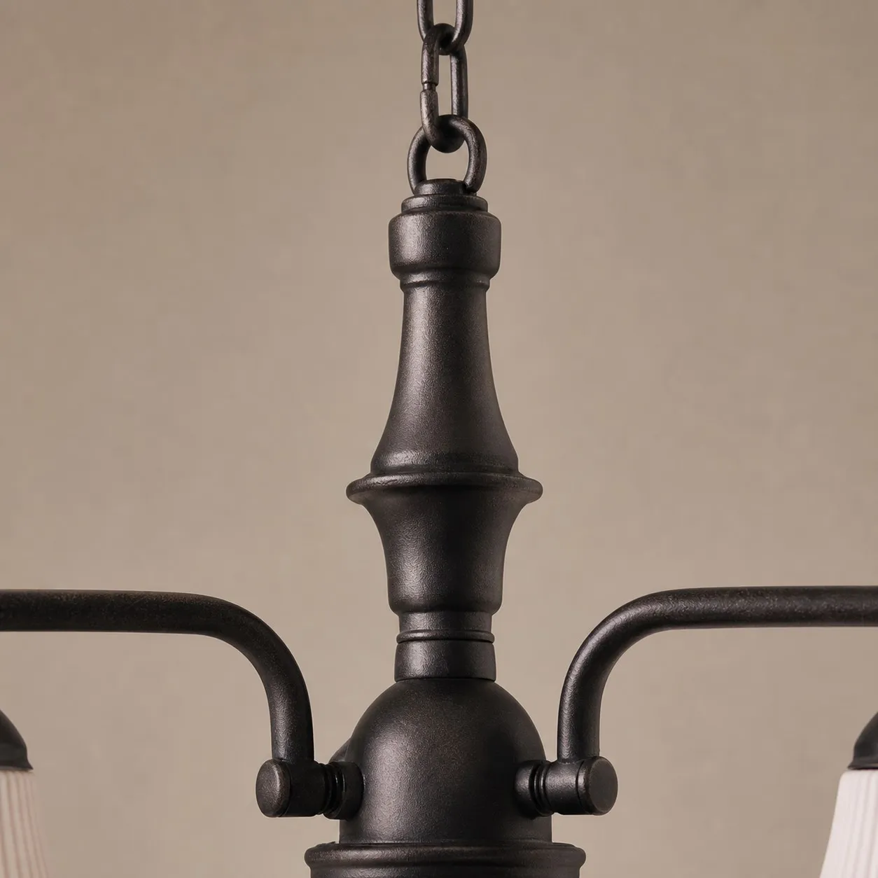 Close view of black iron center column and chain