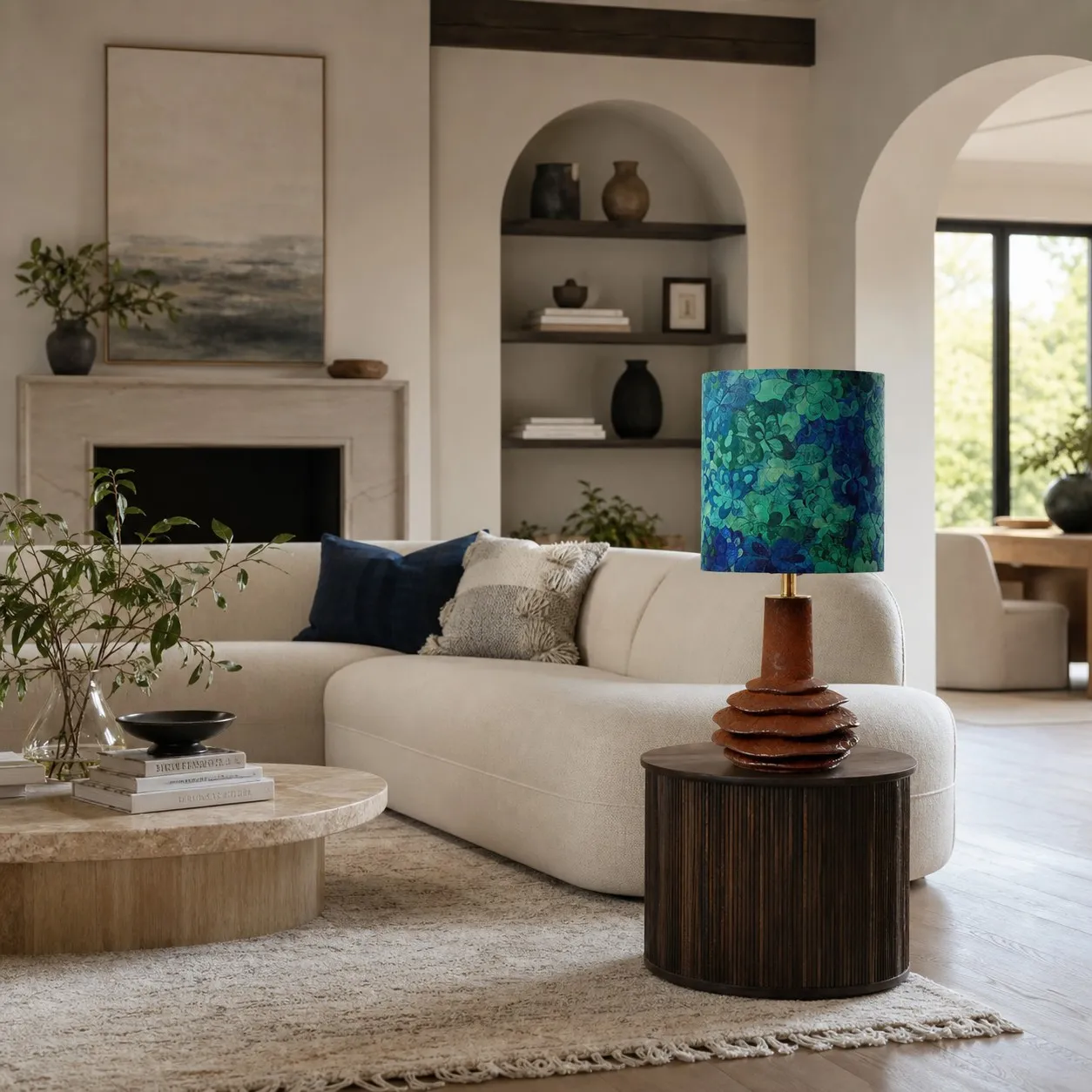 Teal botanical ceramic table lamp in a living room