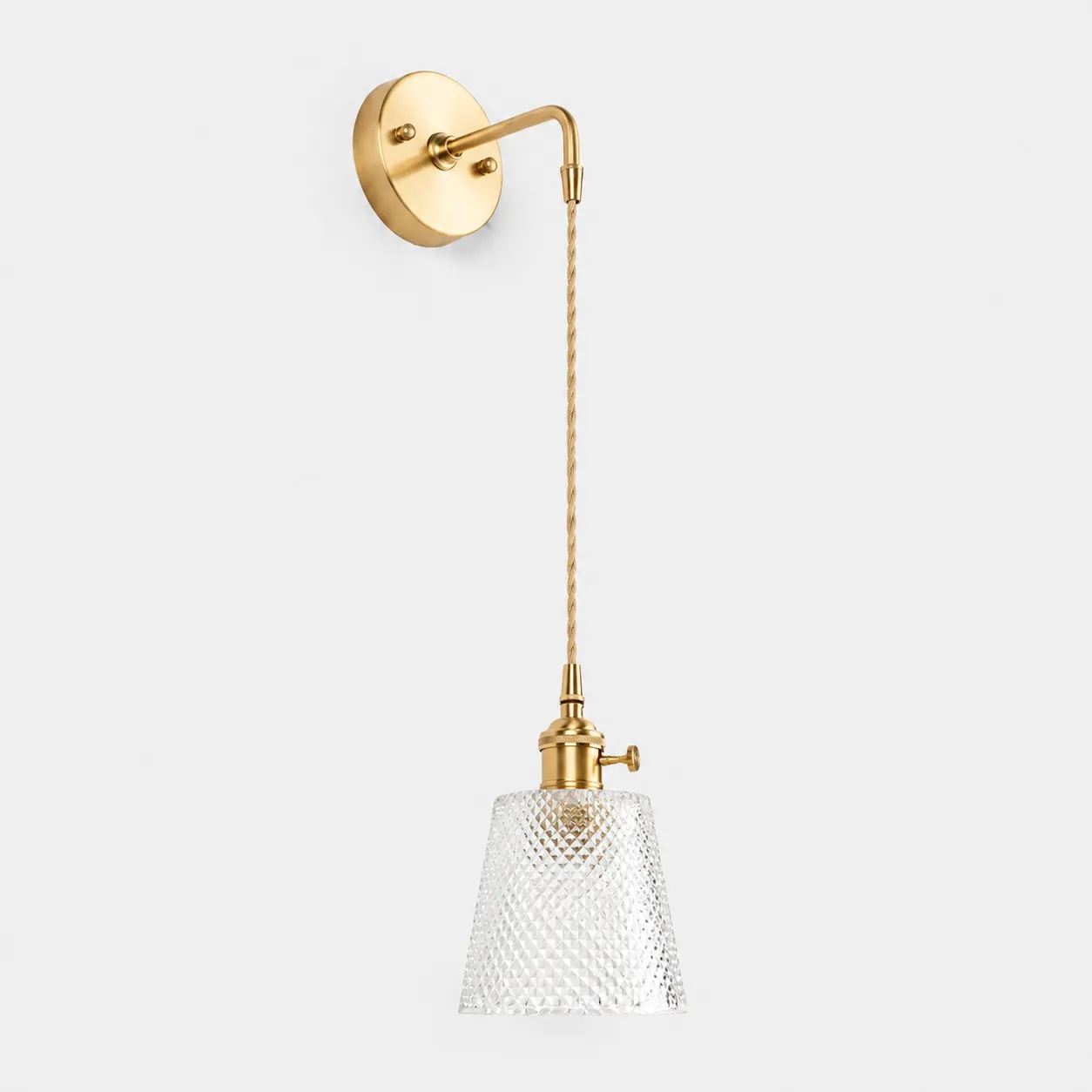 Clear faceted glass wall light with brass arm, AW shade 12 cm high and 13 cm diameter