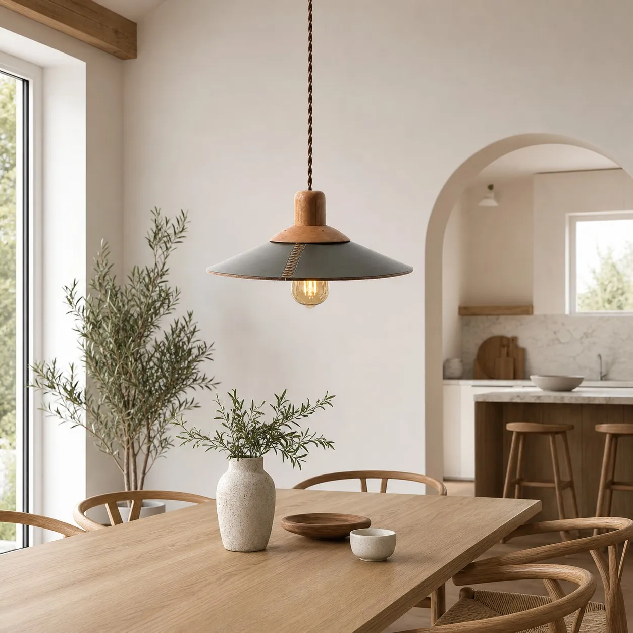 Dark green leather pendant above a dining table