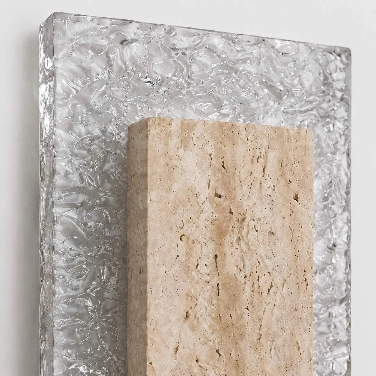 Travertine and textured acrylic material detail