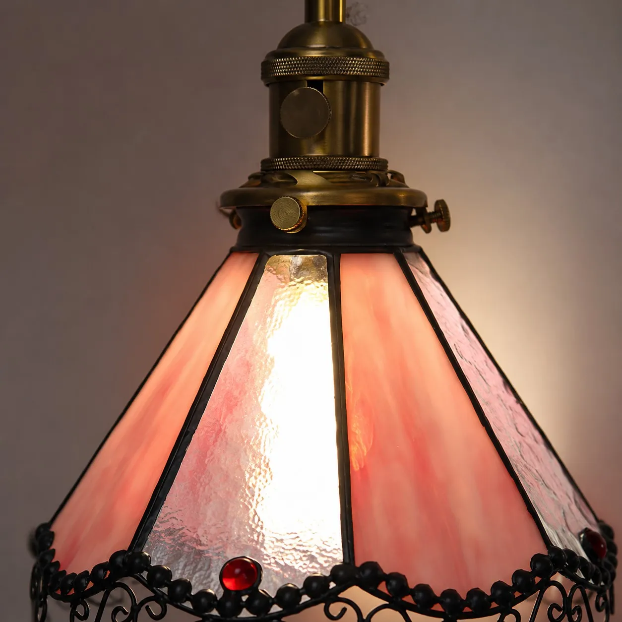 Close detail of pink stained glass shade