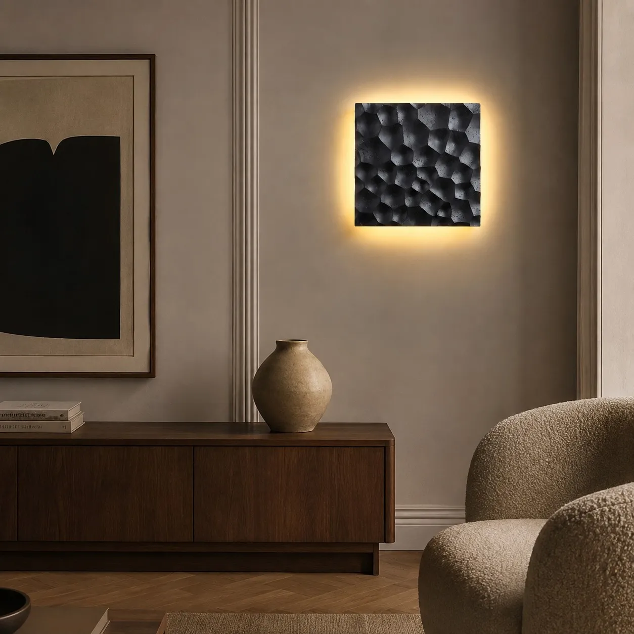 Black carved travertine wall sconce on contemporary living room wall