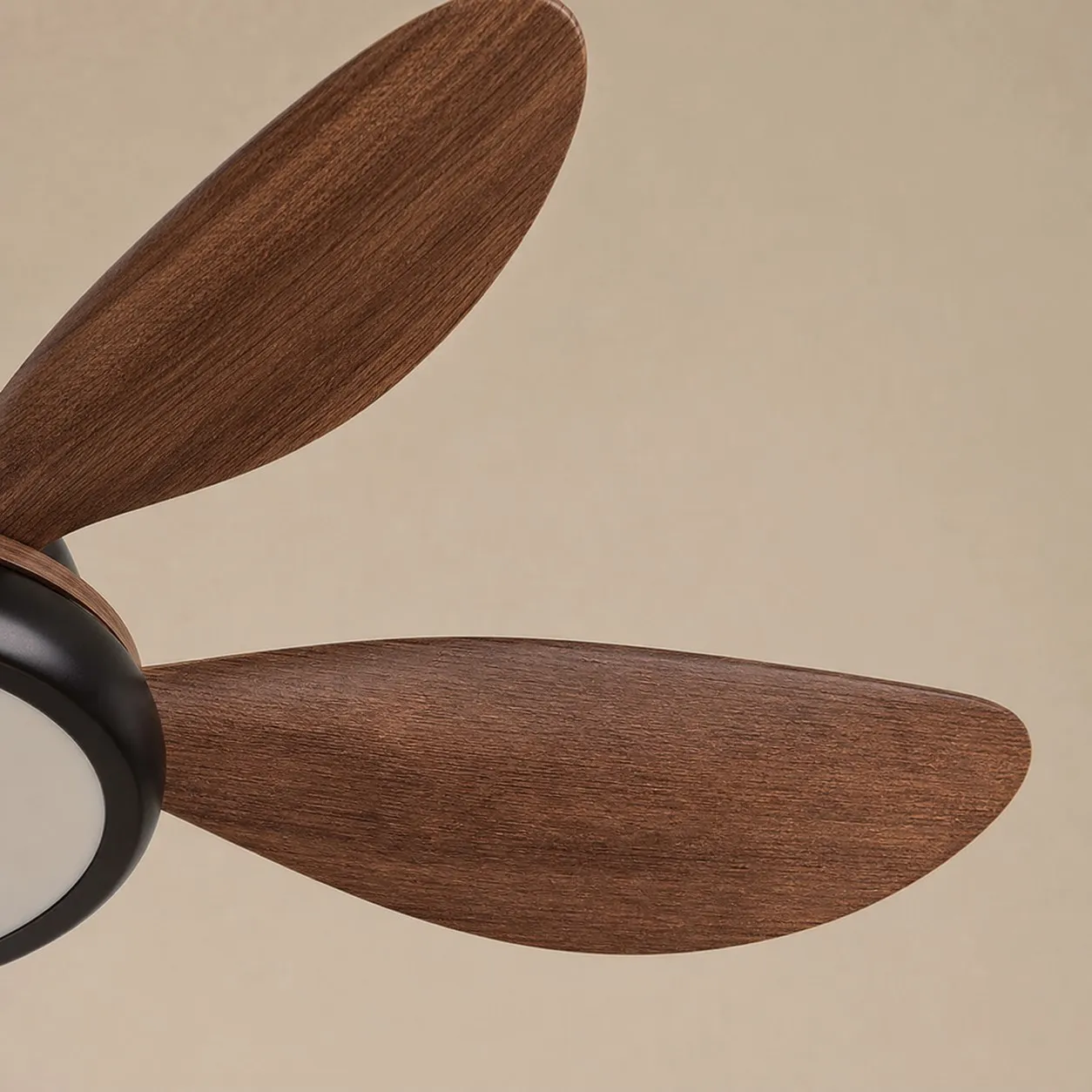 Wood-grain ceiling fan blade close detail