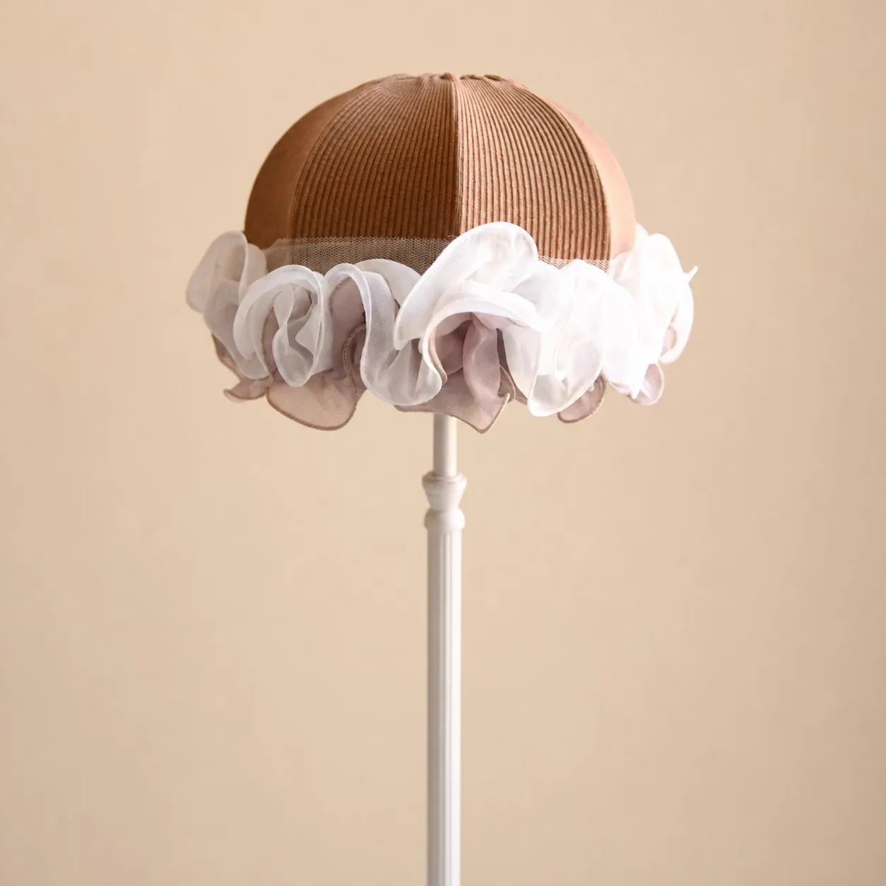 Sheer fabric ruffle and brown cloth lampshade close-up