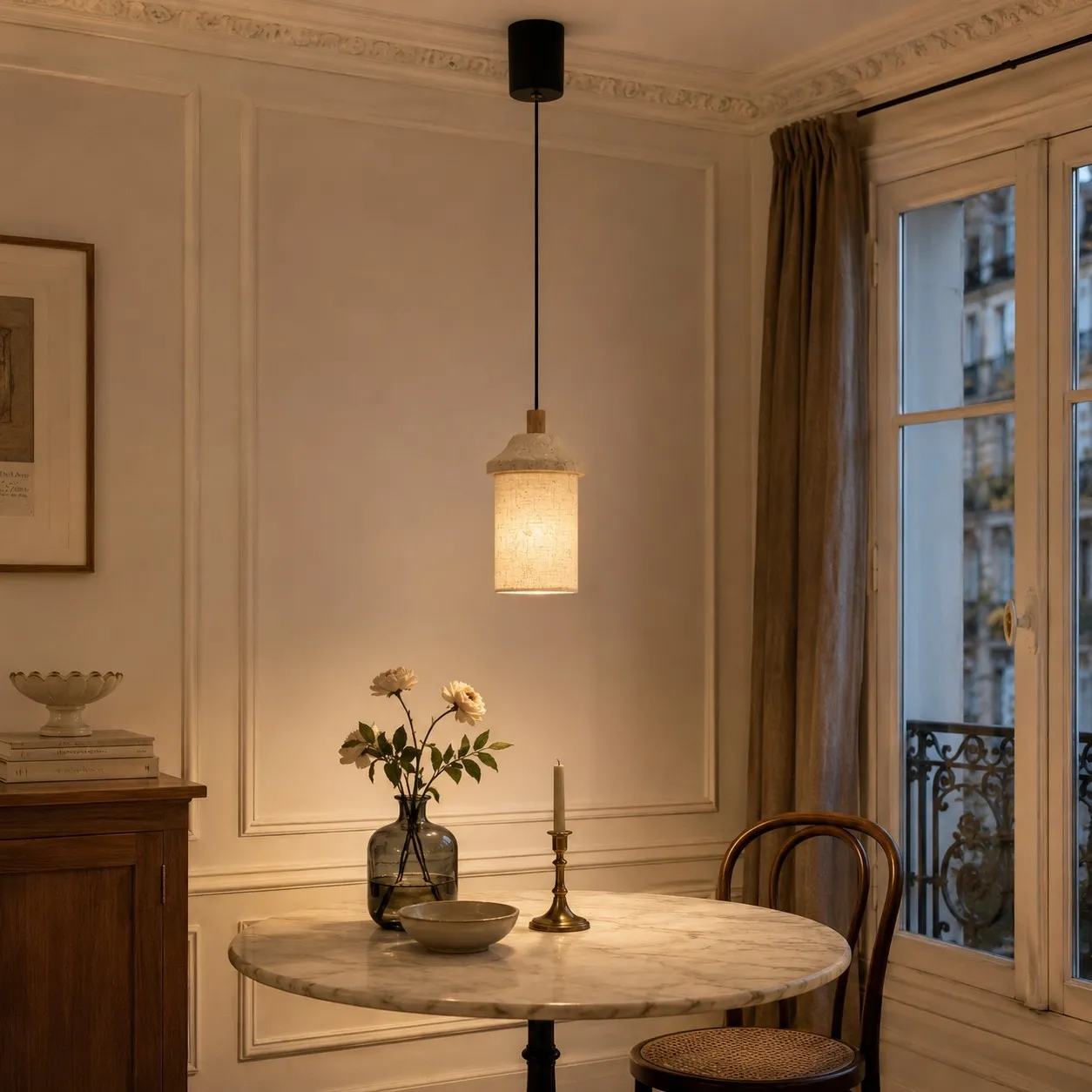 Adjustable walnut travertine-style pendant over Paris dining table