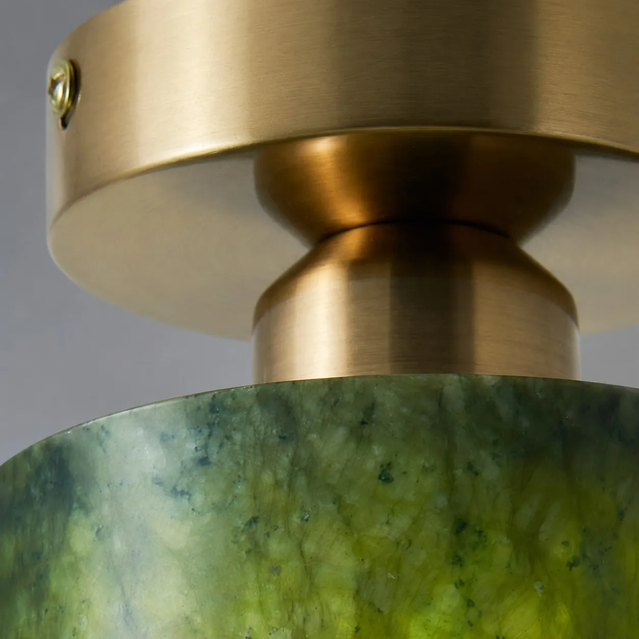 close view of brushed gold metal ceiling plate