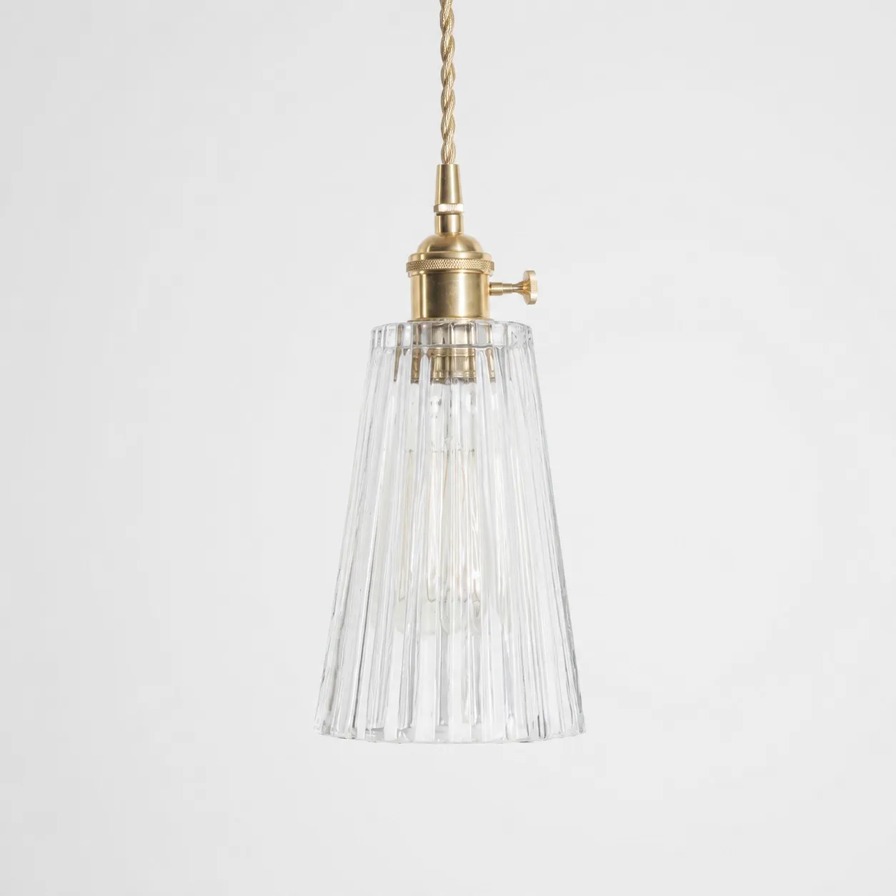 Style G textured glass shade with antique brass E27 socket, front view