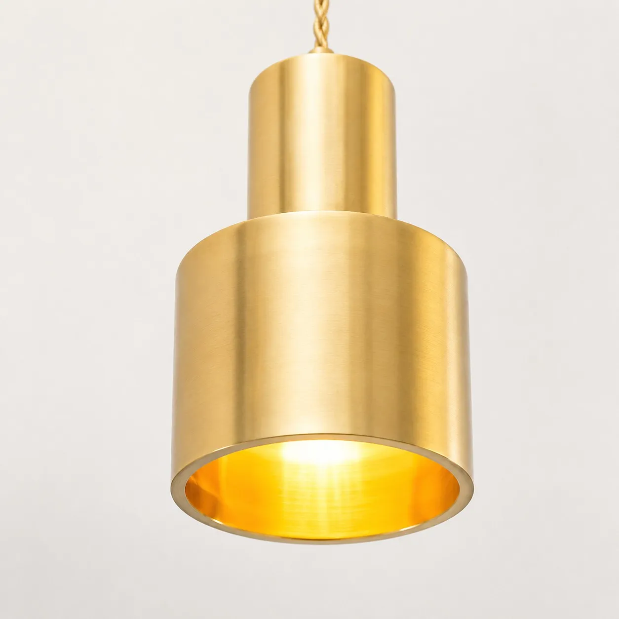 Close view of the brass shade and warm inner rim