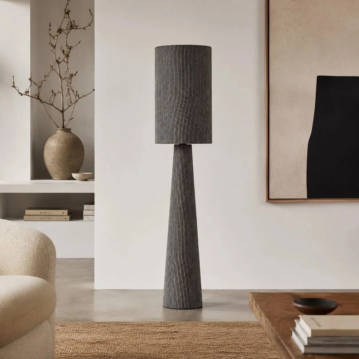 Tall gray striped floor lamp in a modern neutral room