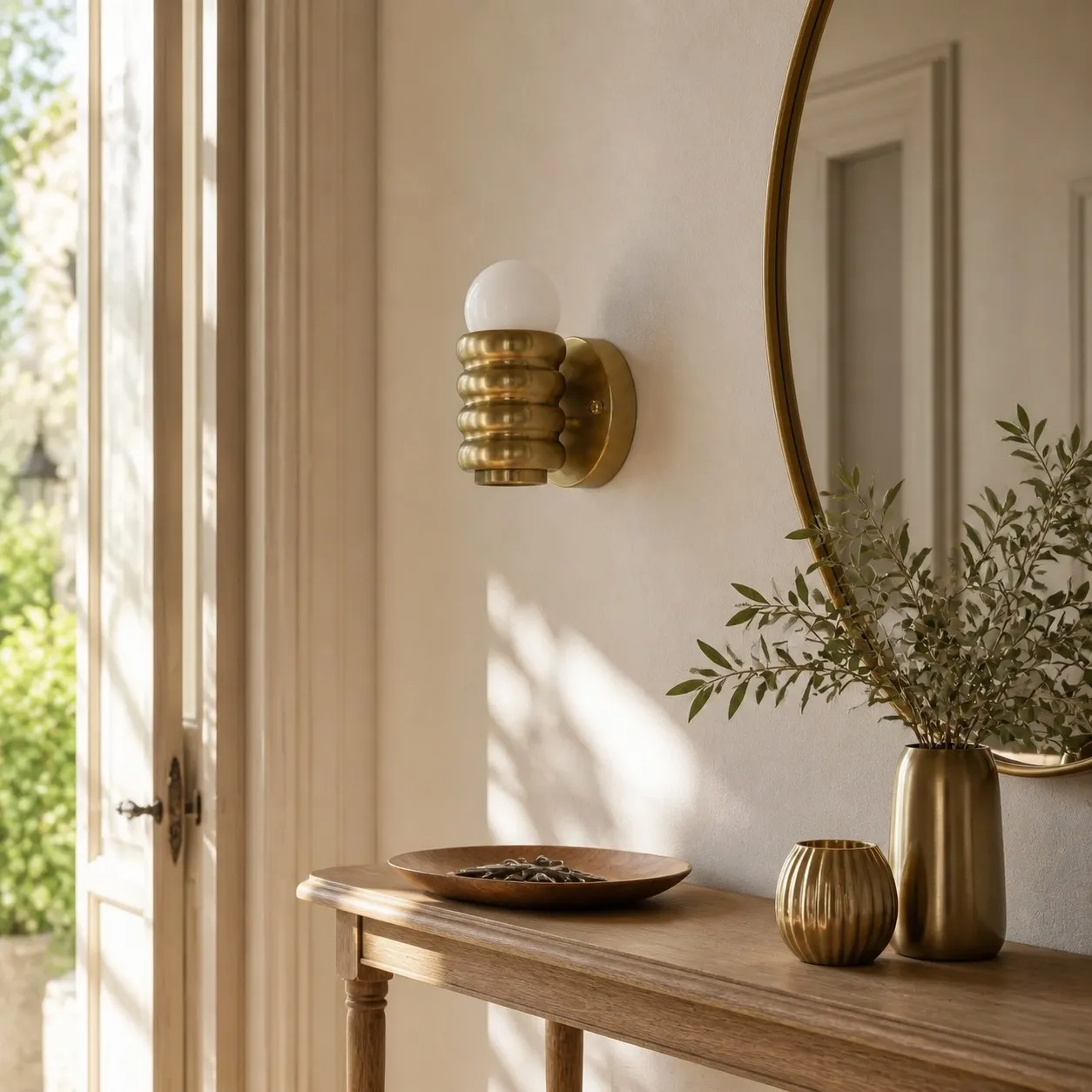 Copper wall sconce above entrance console