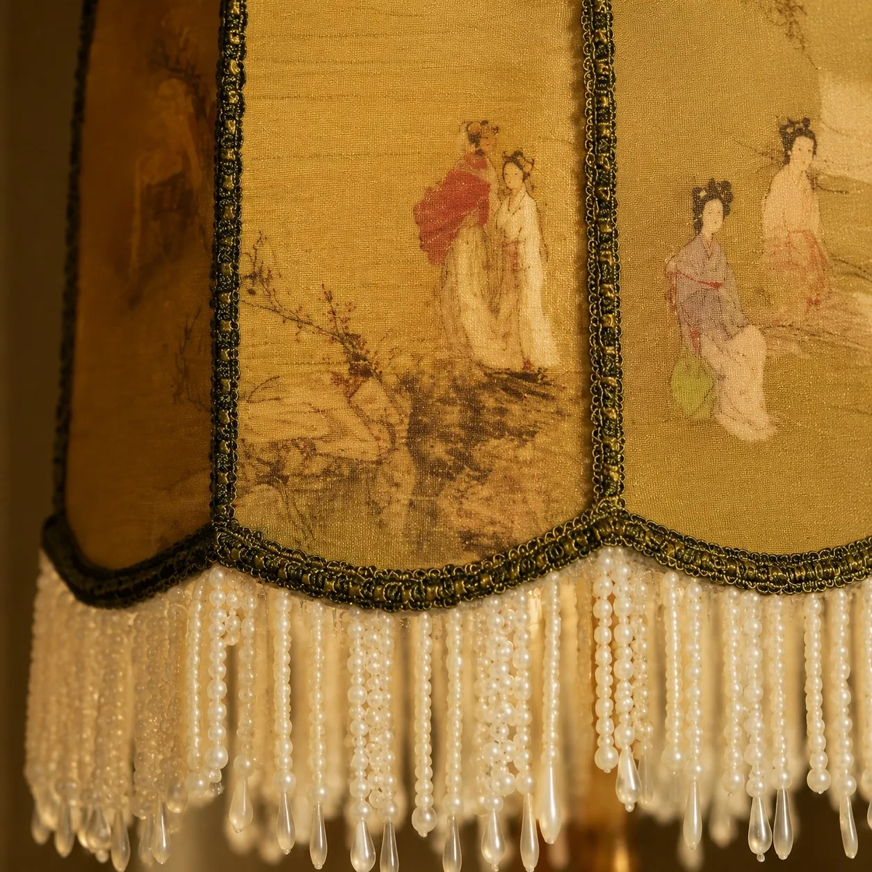 Close-up of chinoiserie fabric shade and beaded fringe