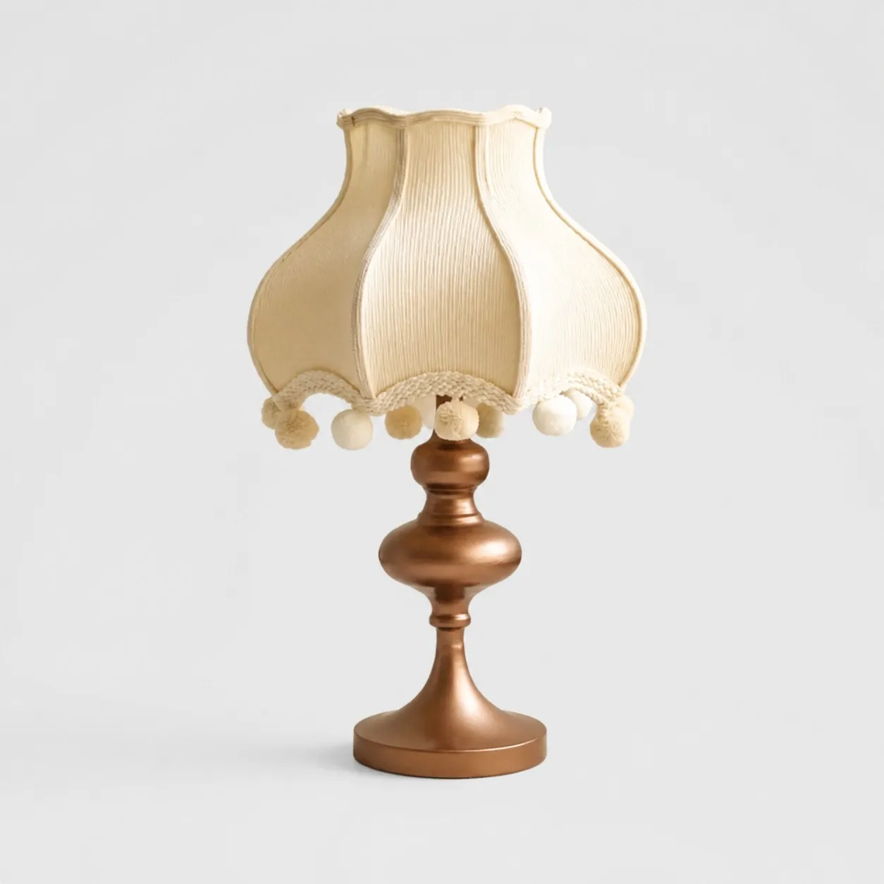 Cream fabric pom-pom table lamp with ivory trim