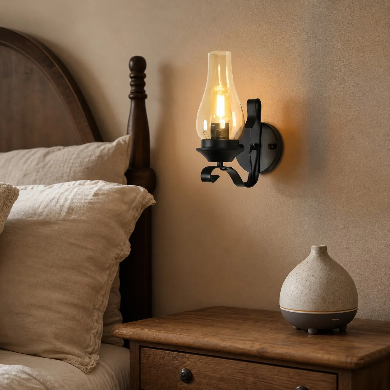 Industrial kerosene style wall lamp mounted beside a bed