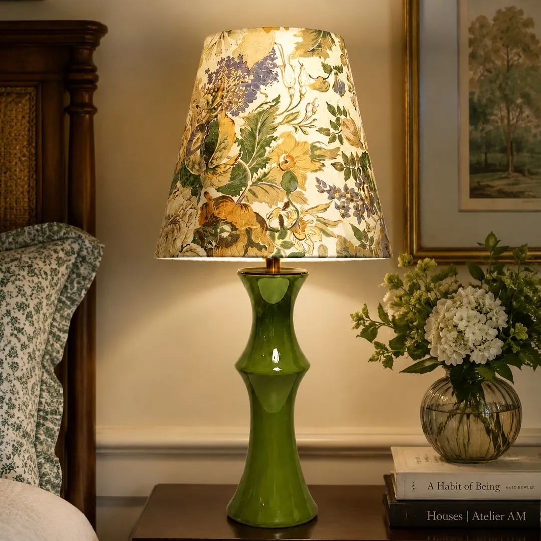 Beige floral table lamp on a bedroom side table